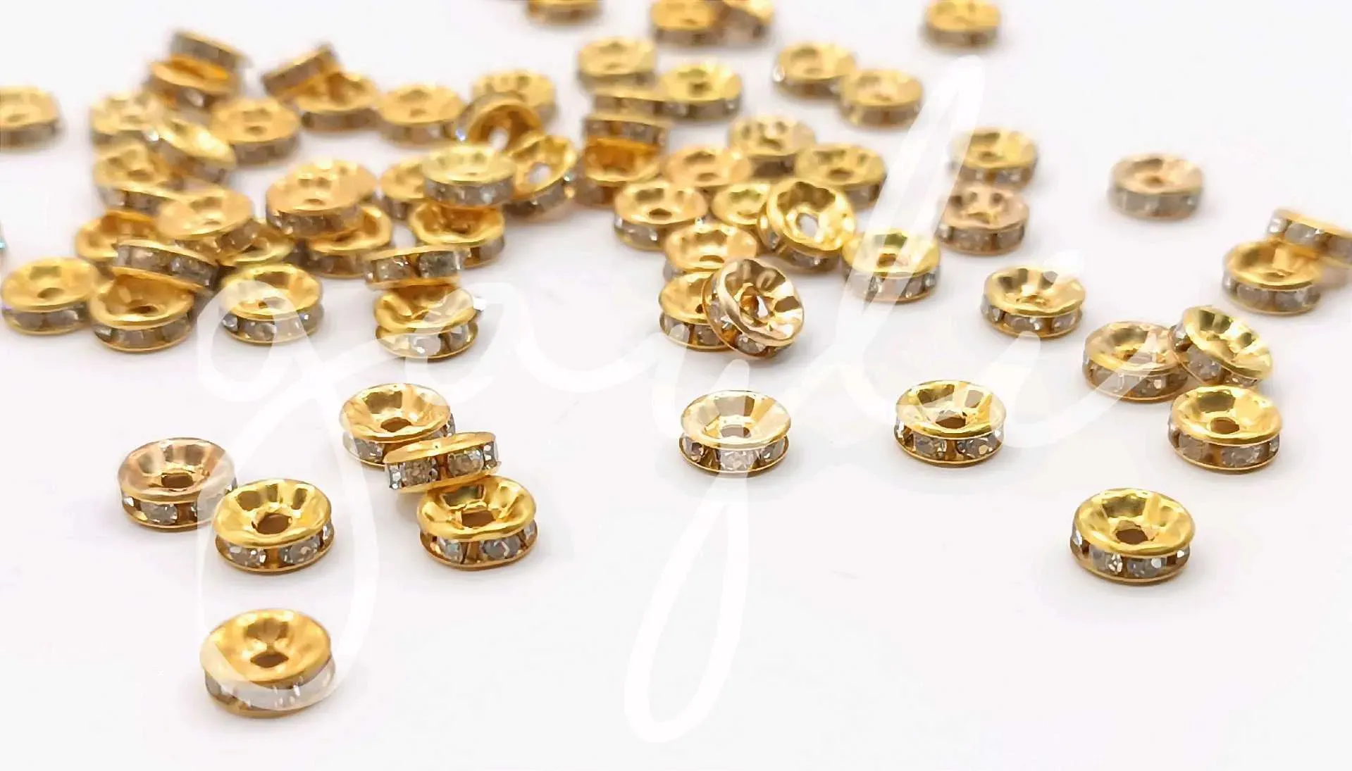 Separador rondel dorado 6mm / 100 unidades